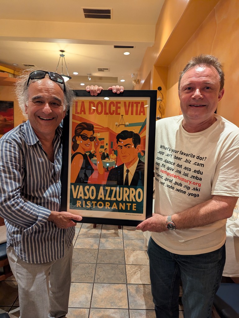 Michael and Francois with a restaurant.art framed print